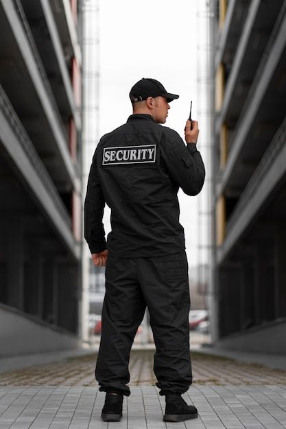 Premium Photo _ Portrait of male security guard with radio station